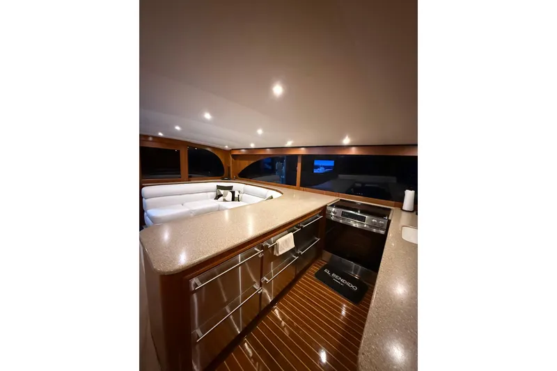 Slide: The Image of Luxurious interior of 2006 Blackwell 66 Convertible yacht with modern kitchen and seating area. - 21