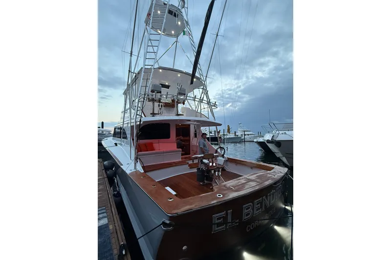 Slide: The Image of 2006 Blackwell 66 Convertible yacht docked at marina during twilight. - 26