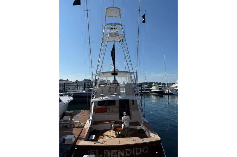 Slide: The Image of 2006 Blackwell 66 Convertible yacht docked at marina, rear view. - 27