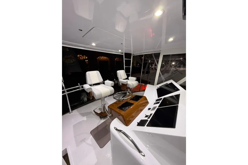 Slide: The Image of Interior of 2006 Blackwell 66 Convertible yacht with modern helm and seating. - 7