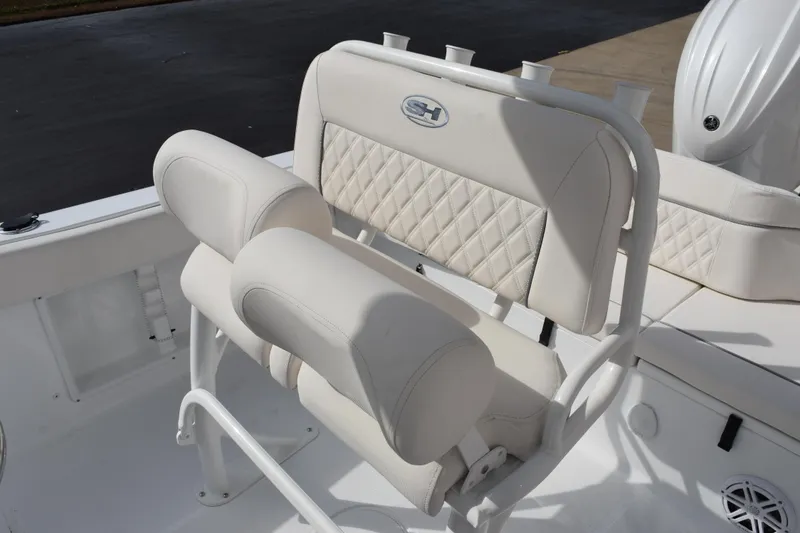 Slide: The Image of 2026 Sea Hunt Ultra 219 boat seating with white cushioned upholstery and diamond stitching. - 10