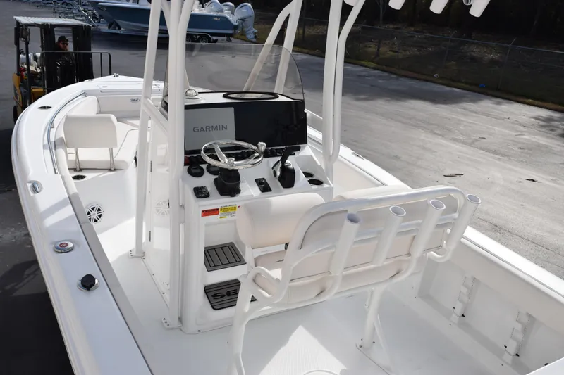 Slide: The Image of 2026 Sea Hunt Ultra 219 boat interior with Garmin navigation system and seating. - 8