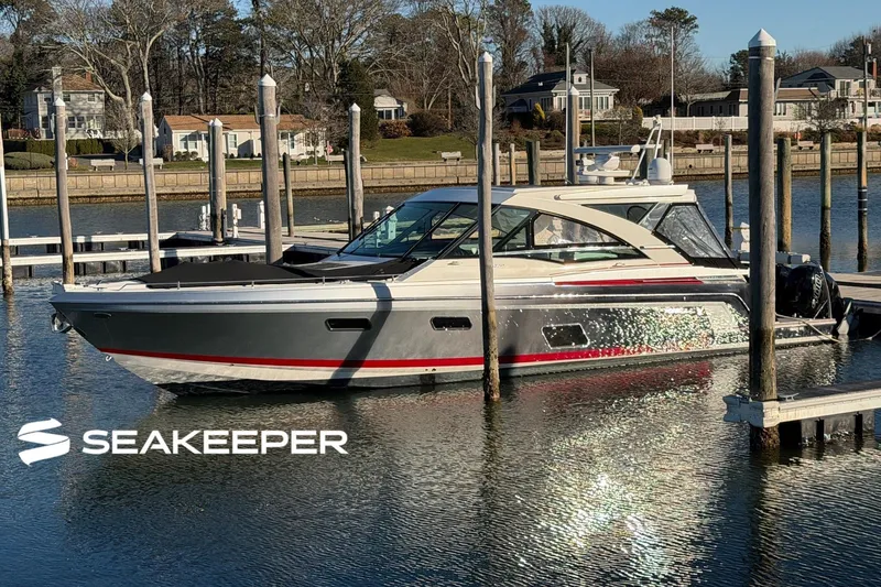 The Image of 2017 Formula 430 Super Sport Crossover yacht docked at marina with Seakeeper logo. - 0