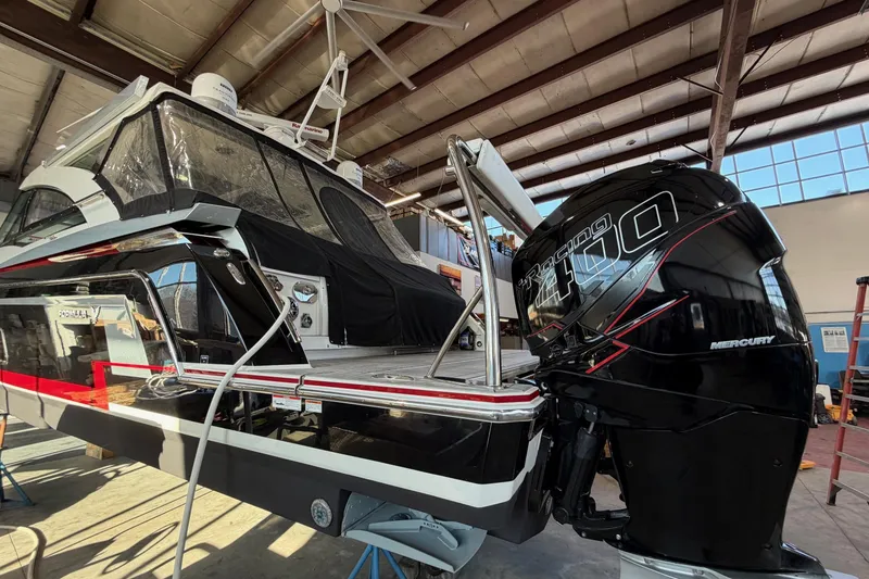 Slide: The Image of 2017 Formula 430 Super Sport Crossover with Mercury Racing 400 engine in a boatyard. - 11