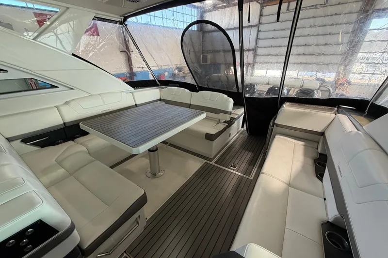 Slide: The Image of 2017 Formula 430 Super Sport Crossover interior with luxurious seating and table. - 19