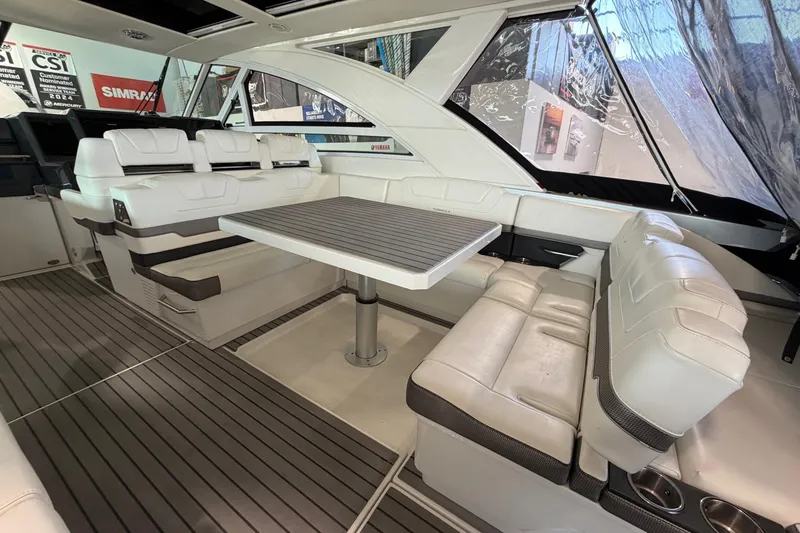 Slide: The Image of 2017 Formula 430 Super Sport Crossover interior with white seating and a central table. - 20