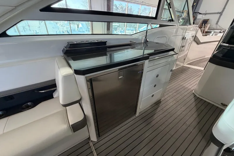 Slide: The Image of 2017 Formula 430 Super Sport Crossover interior with sleek kitchenette and modern design. - 22