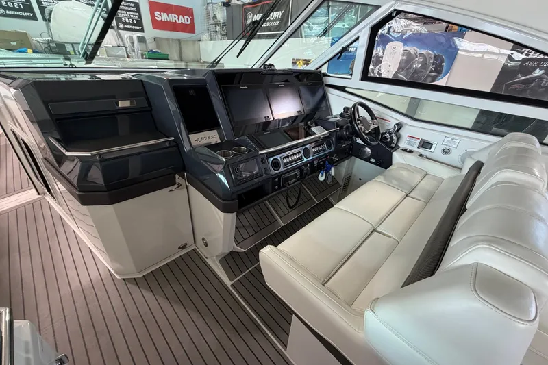 Slide: The Image of 2017 Formula 430 Super Sport Crossover cockpit with modern controls and leather seating. - 24