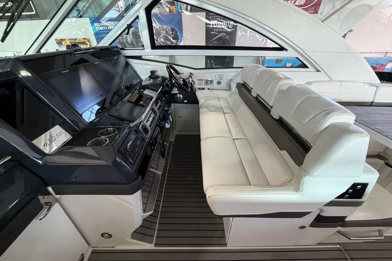 Slide: The Image of 2017 Formula 430 Super Sport Crossover cockpit with luxurious seating and advanced controls. - 25