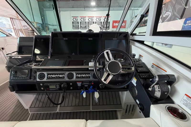 Slide: The Image of 2017 Formula 430 Super Sport Crossover helm with advanced navigation controls. - 26