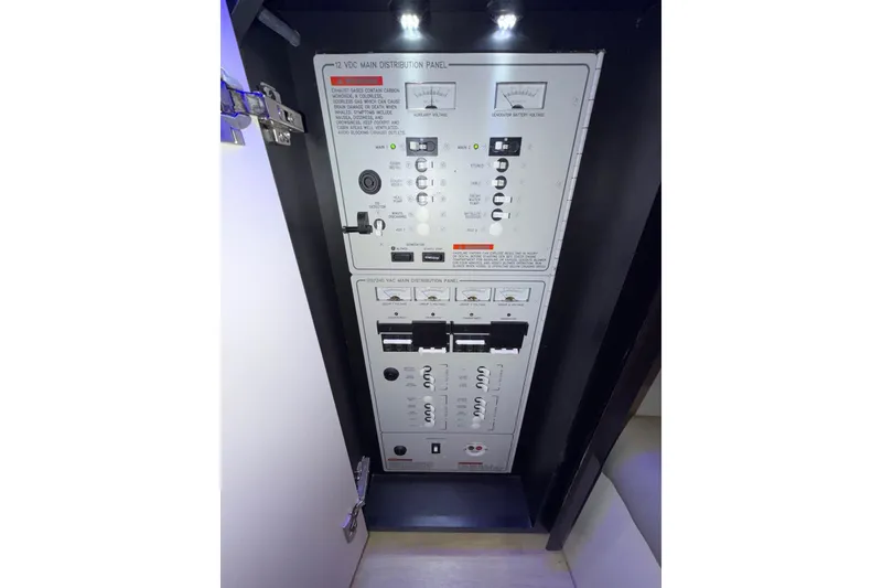 Slide: The Image of Electrical panel inside 2017 Formula 430 Super Sport Crossover boat, featuring various switches and meters. - 28