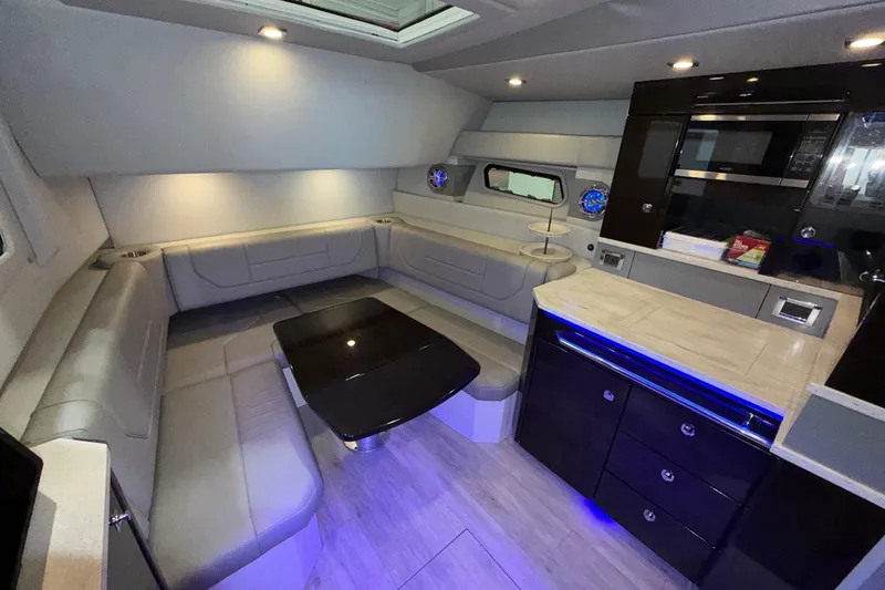 Slide: The Image of Luxurious interior of 2017 Formula 430 Super Sport Crossover yacht with modern seating and kitchenette. - 29