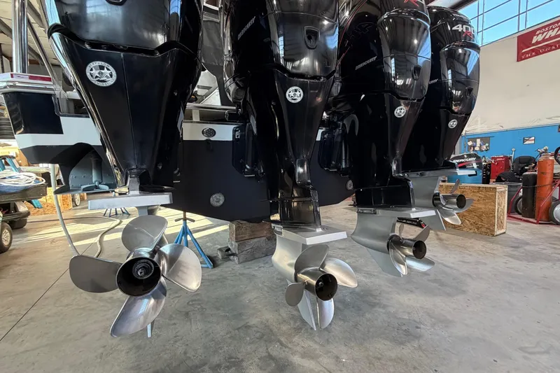 Slide: The Image of 2017 Formula 430 Super Sport Crossover with powerful Mercury outboard engines in a workshop setting. - 3