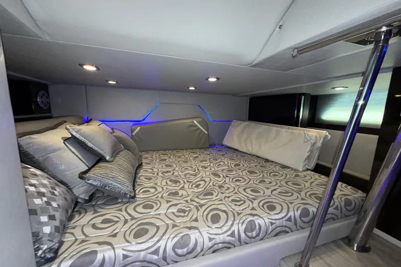 Slide: The Image of Luxurious cabin interior of 2017 Formula 430 Super Sport Crossover with modern bedding and ambient lighting. - 33