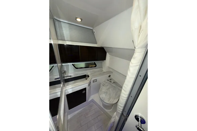 Slide: The Image of Interior of 2017 Formula 430 Super Sport Crossover bathroom with modern fixtures and sleek design. - 34