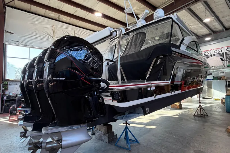 Slide: The Image of 2017 Formula 430 Super Sport Crossover boat with powerful Mercury outboard engines in a workshop. - 5