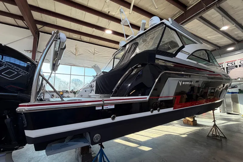 Slide: The Image of 2017 Formula 430 Super Sport Crossover boat in a warehouse, side view. - 54