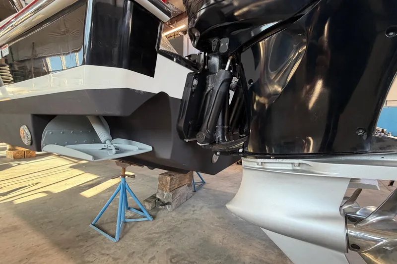 Slide: The Image of 2017 Formula 430 Super Sport Crossover boat engine detail in a workshop setting. - 6