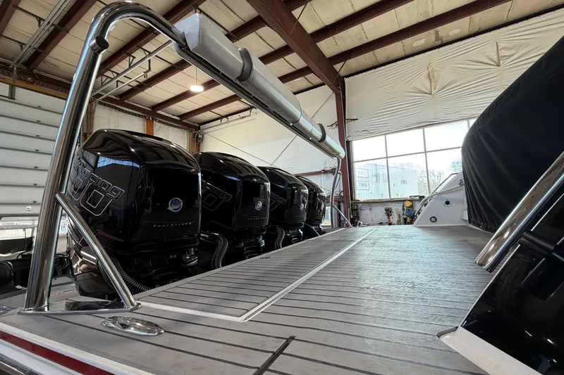 Slide: The Image of 2017 Formula 430 Super Sport Crossover with powerful outboard engines in a boat garage. - 7