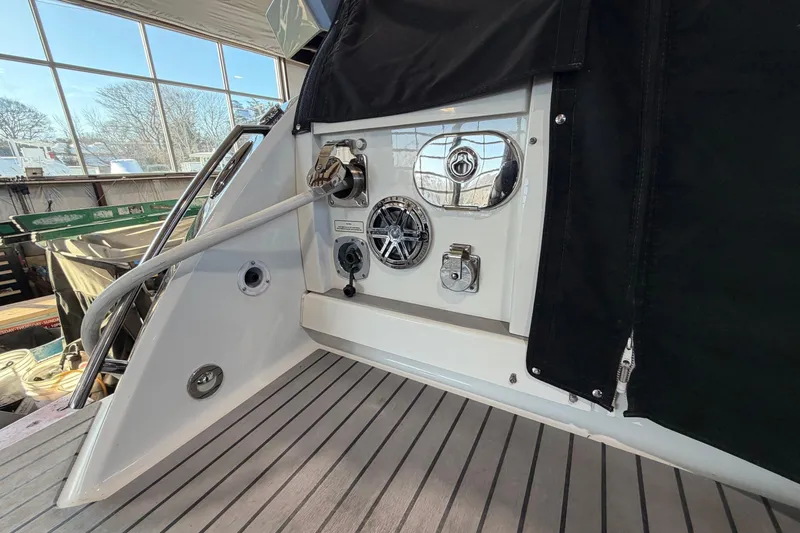 Slide: The Image of 2017 Formula 430 Super Sport Crossover boat deck with utility connections and speaker. - 8