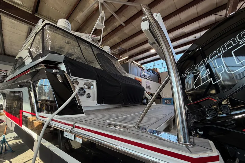 Slide: The Image of 2017 Formula 430 Super Sport Crossover boat in a warehouse, showcasing sleek design and powerful engine. - 9
