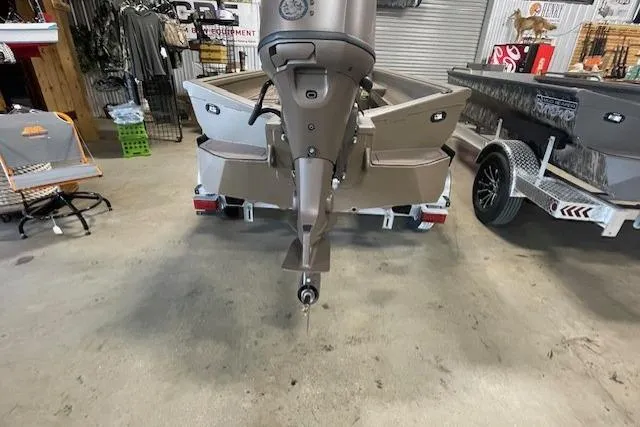 Slide: The Image of 2026 Reaper Boats 753-1878 model in showroom, rear view with motor and trailer. - 2