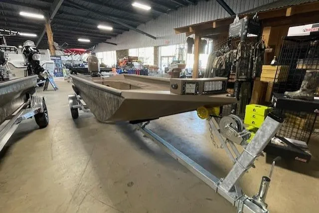 Slide: The Image of 2026 Reaper Boats 753-1878 model displayed indoors on a trailer. - 5