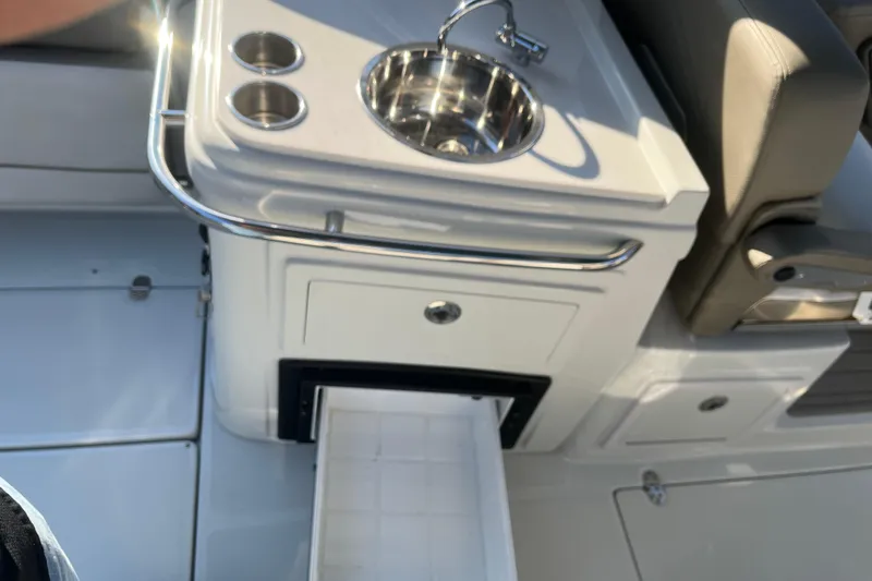 Slide: The Image of 2022 Finseeker 280 DC boat interior with sink and storage drawer. - 16