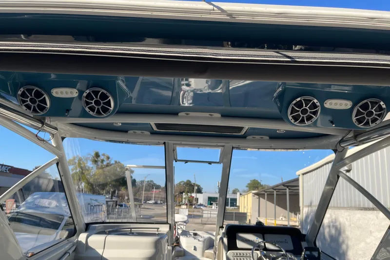 Slide: The Image of 2022 Finseeker 280 DC boat interior with speakers and navigation equipment. - 17