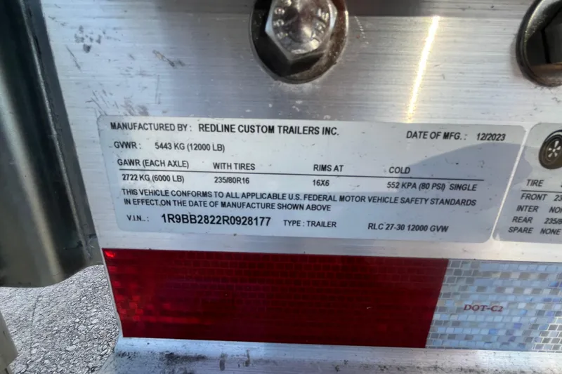 Slide: The Image of Label on Redline Custom Trailers, Inc. trailer, showing specifications and compliance details. - 27