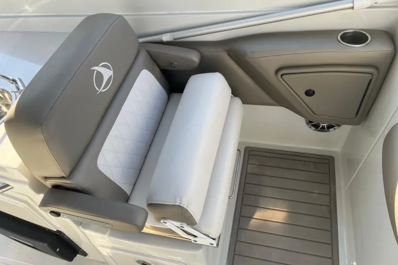 Slide: The Image of 2022 Finseeker 280 DC boat seat with cup holder and storage compartment. - 3