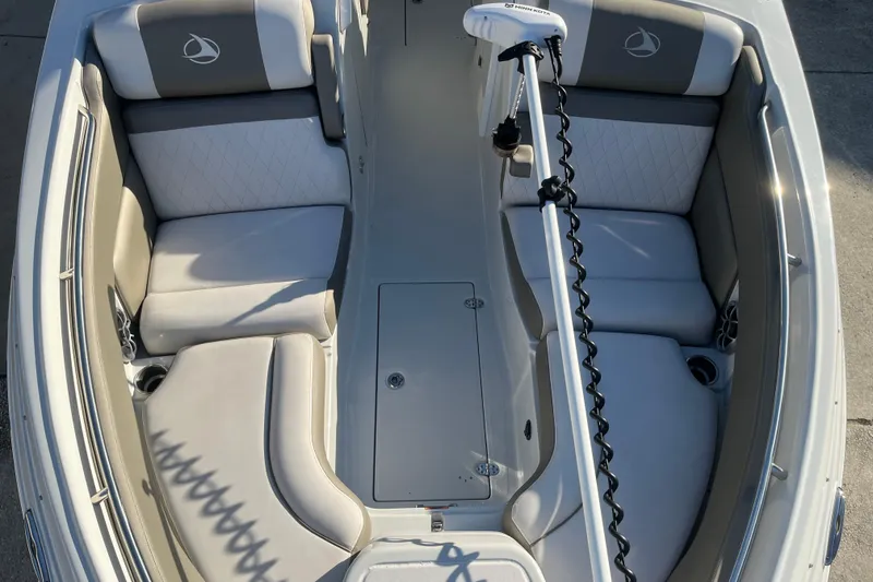 Slide: The Image of 2022 Finseeker 280 DC boat interior with cushioned seating and modern design. - 30