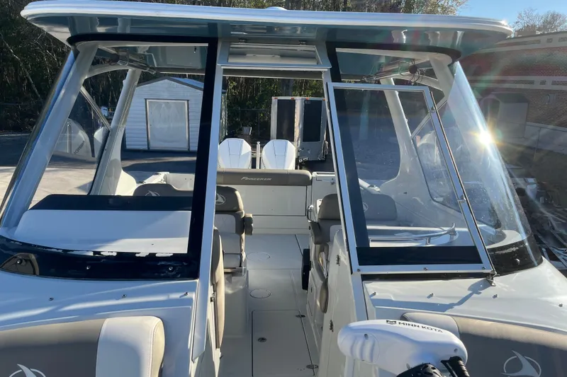 Slide: The Image of 2022 Finseeker 280 DC boat interior with seating and glass windshield. - 37
