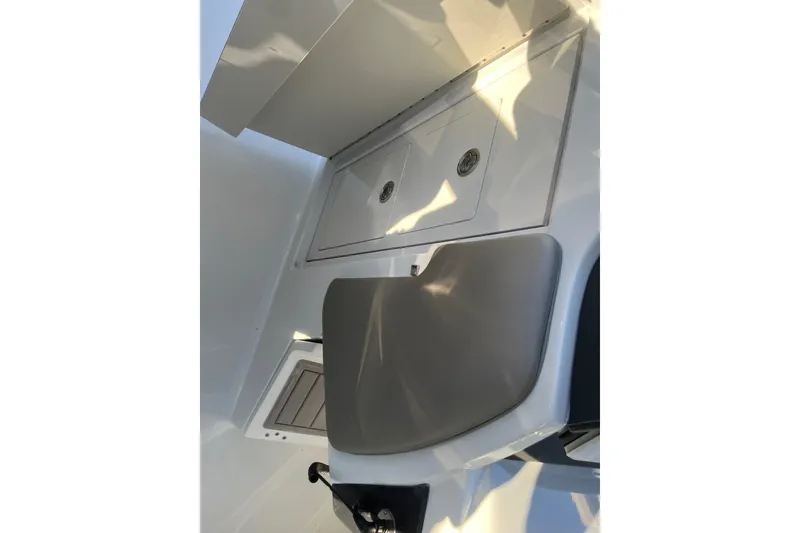 Slide: The Image of 2022 Finseeker 280 DC boat interior with storage compartments and seating. - 39