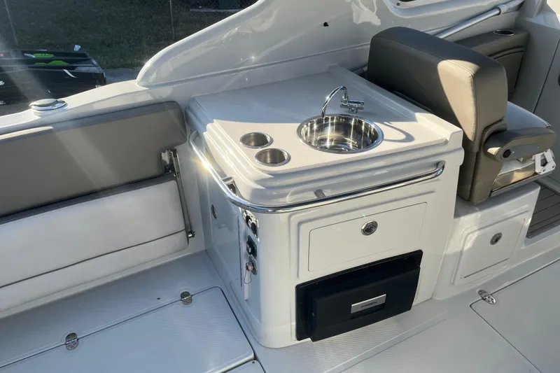 Slide: The Image of 2022 Finseeker 280 DC boat interior with sink and seating area. - 7