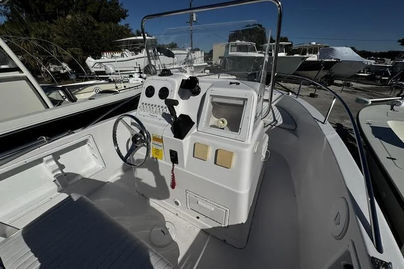 Slide: The Image of 2002 Pro-Line 19 Sport boat interior with steering console and controls. - 9