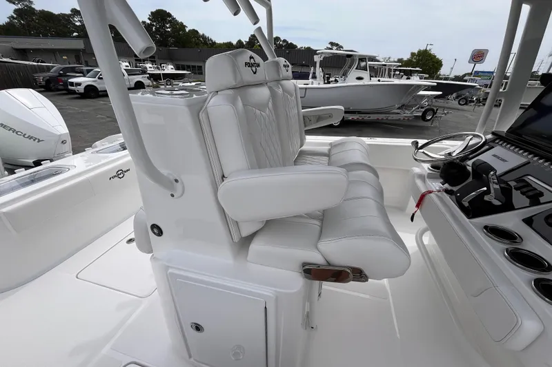 Slide: The Image of 2025 Fountain 34 Tournament Edition boat interior with white seating and control panel. - 10