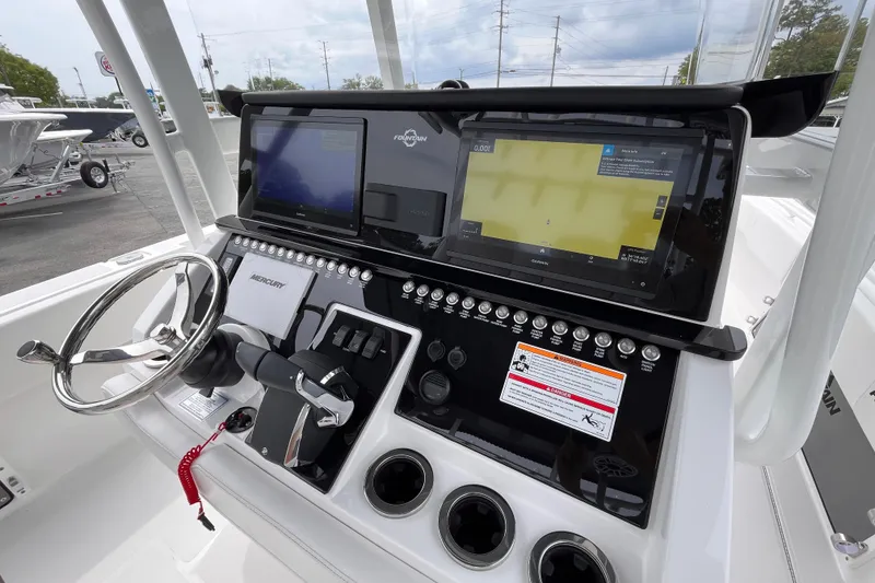 Slide: The Image of 2025 Fountain 34 Tournament Edition boat dashboard with advanced navigation and control systems. - 11