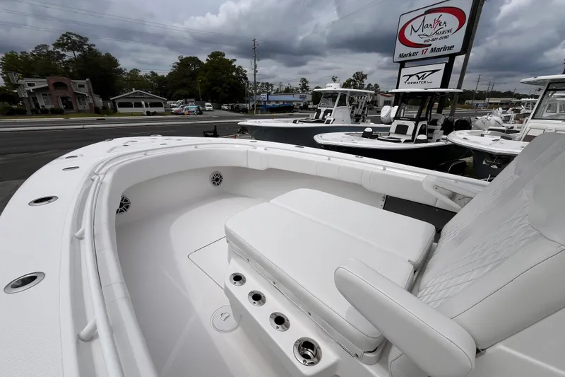 Slide: The Image of 2025 Fountain 34 Tournament Edition boat with spacious seating at a marina. - 15