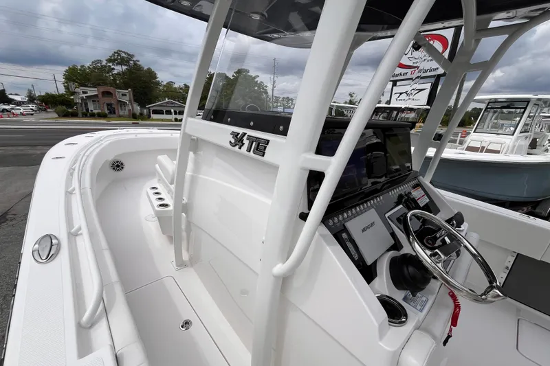 Slide: The Image of 2025 Fountain 34 Tournament Edition boat, sleek design, modern dashboard, and spacious deck. - 16