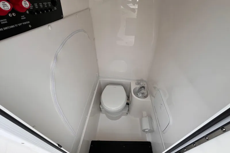 Slide: The Image of 2025 Fountain 34 Tournament Edition boat interior with compact marine toilet. - 21