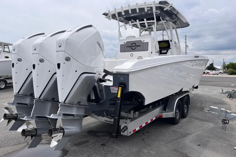 Slide: The Image of 2025 Fountain 34 Tournament Edition boat with triple Mercury outboard engines on a trailer. - 5