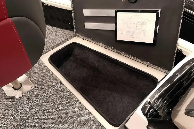 Slide: The Image of 2026 Ranger VS1682SC Angler boat interior with storage compartment and red seat. - 12