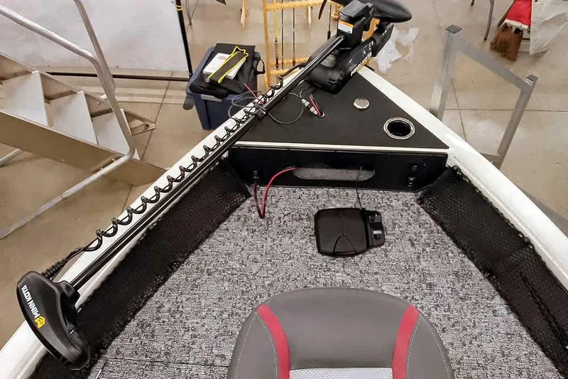 Slide: The Image of 2026 Ranger VS1682SC Angler boat interior with trolling motor and carpeted deck. - 15