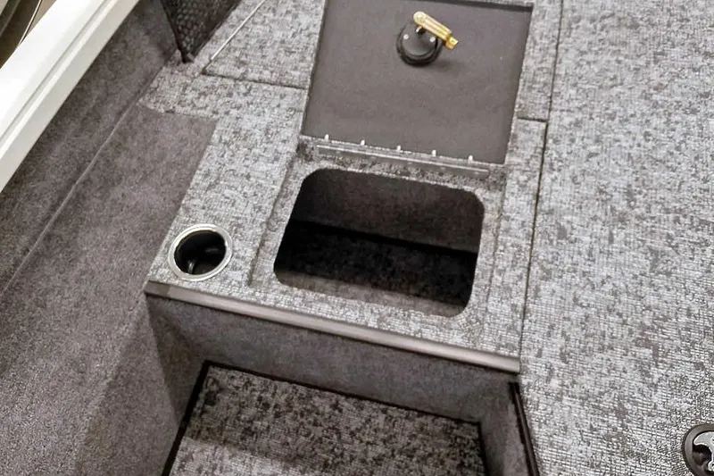 Slide: The Image of 2026 Ranger VS1682SC Angler boat interior with storage compartment and cup holder. - 18