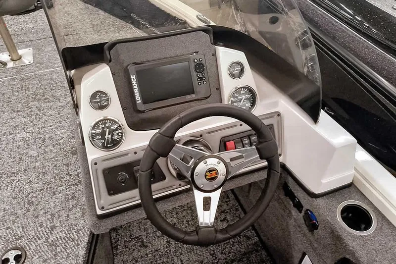 Slide: The Image of 2026 Ranger VS1682SC Angler boat dashboard with steering wheel and navigation controls. - 21