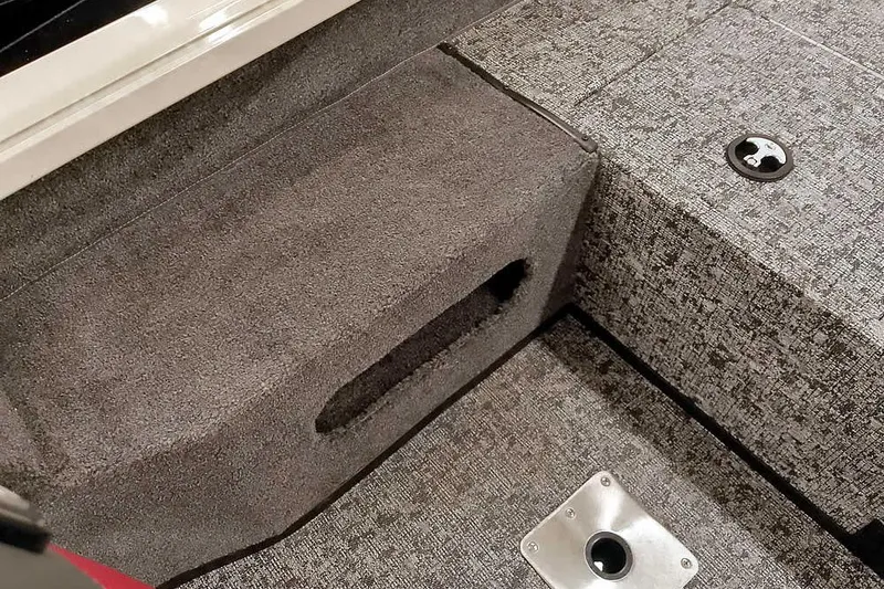 Slide: The Image of 2026 Ranger VS1682SC Angler boat interior with textured flooring and storage compartment. - 23