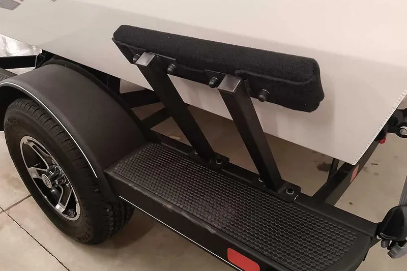 Slide: The Image of Trailer detail of 2026 Ranger VS1682SC Angler boat, featuring wheel and step. - 8