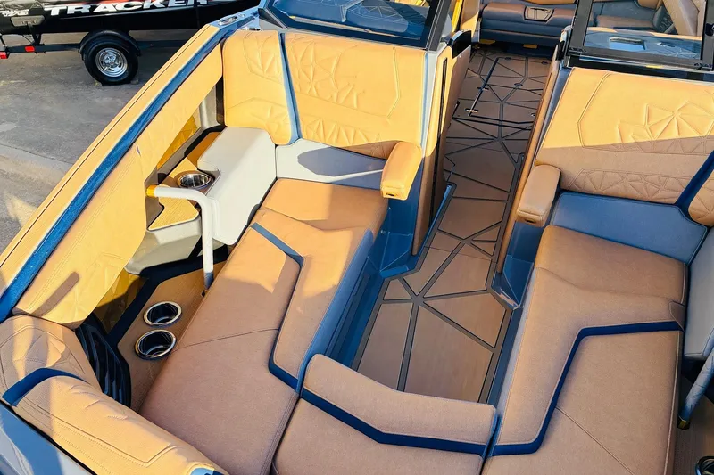 Slide: The Image of Luxurious interior of 2026 Nautique Super Air Nautique G25 Paragon boat with plush seating. - 25