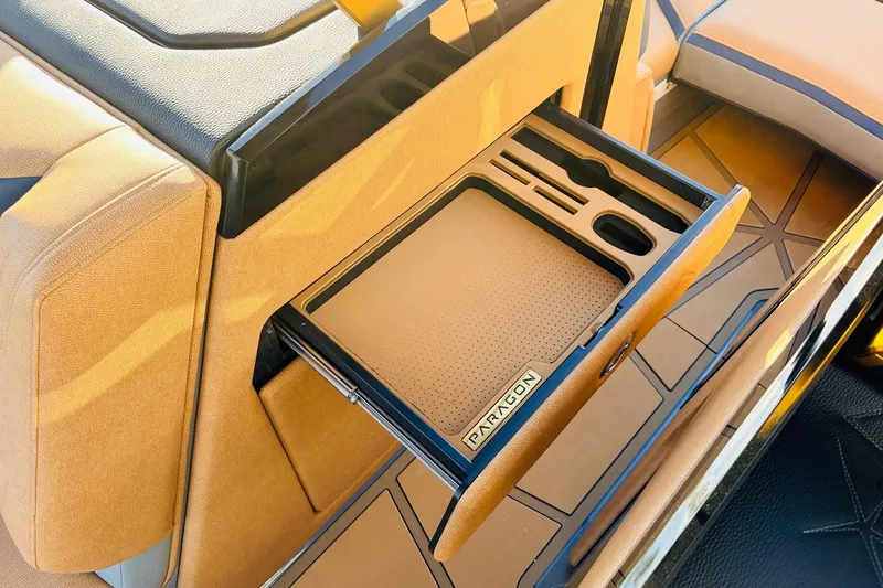 Slide: The Image of 2026 Nautique Super Air Nautique G25 Paragon interior with custom storage compartment. - 37